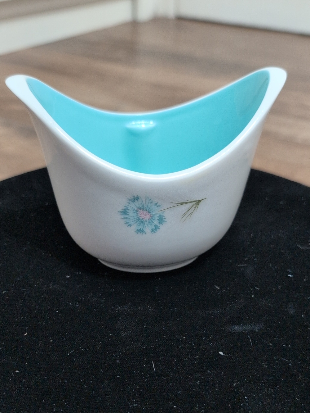 Vintage White Ceramic Bowl with Aqua Interior and Floral Accent